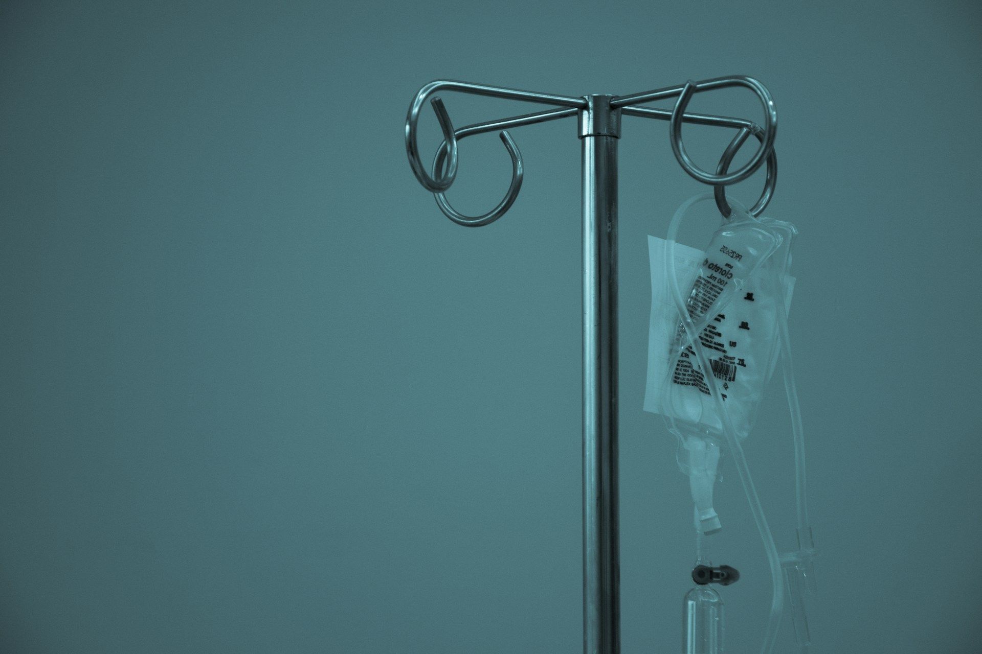 An IV (intravenous) drip bag hanging from a metal stand