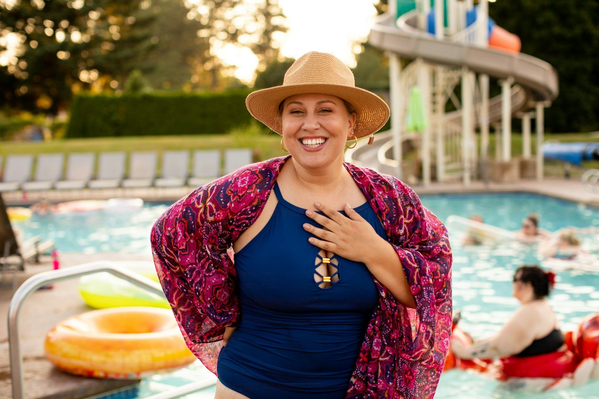 Plus size woman enjoying a summer pool