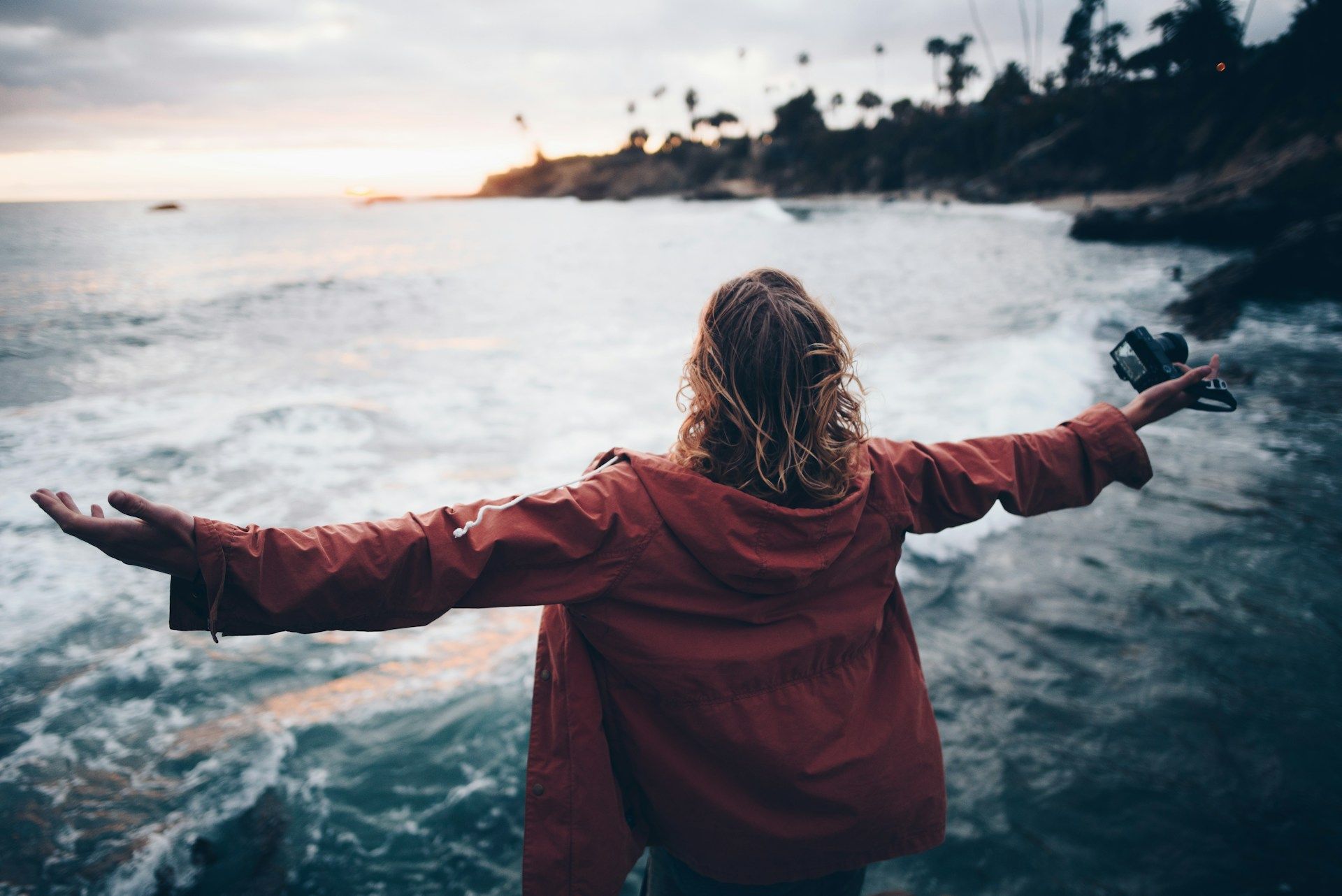 Woman near water with a sense of freedom